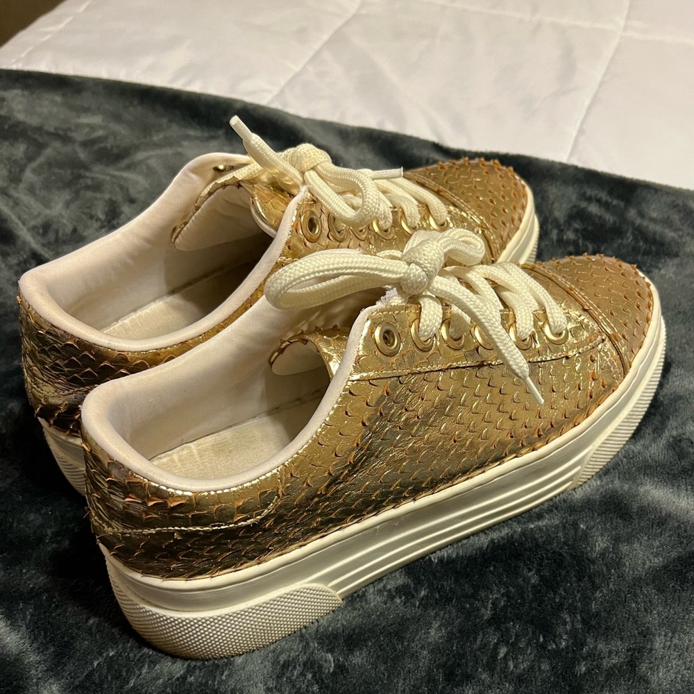 Size 9 gold platform sneakers.